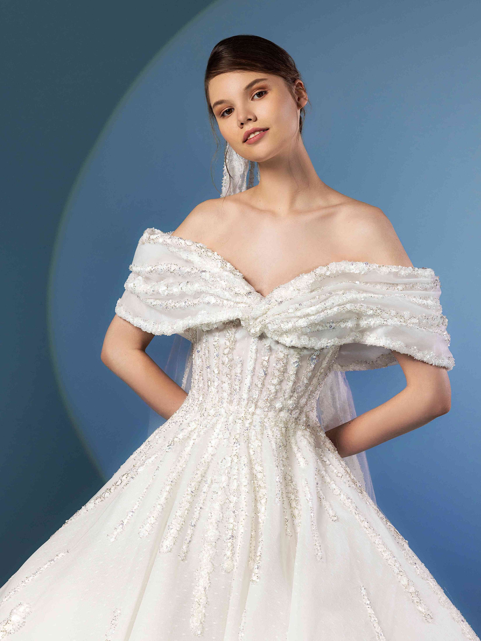 Tulle beaded ball gown with draped off-shoulder draped